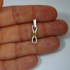 Schmuck aus 925er Silber – Knoten der unendlichen Liebe, handgefertigter Anhänger mit Ewigkeitssymbol im rustikalen Skulpturenstil | Art Diva